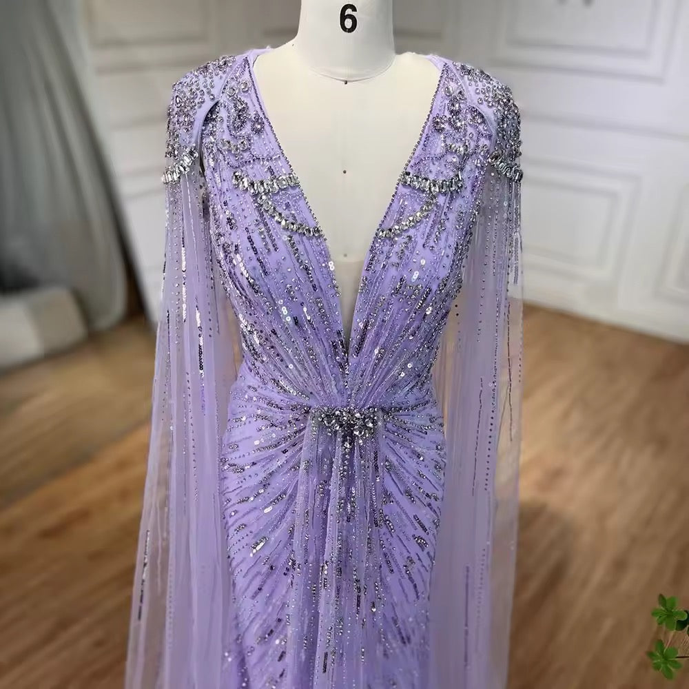 Elegant Fitted Gown with Beaded Details and Dramatic Cape
