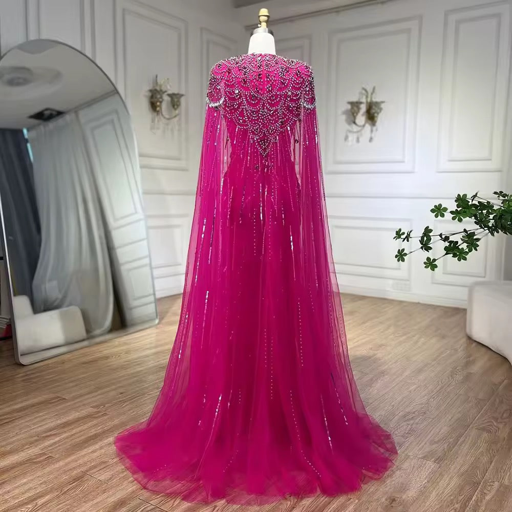 Elegant Fitted Gown with Beaded Details and Dramatic Cape