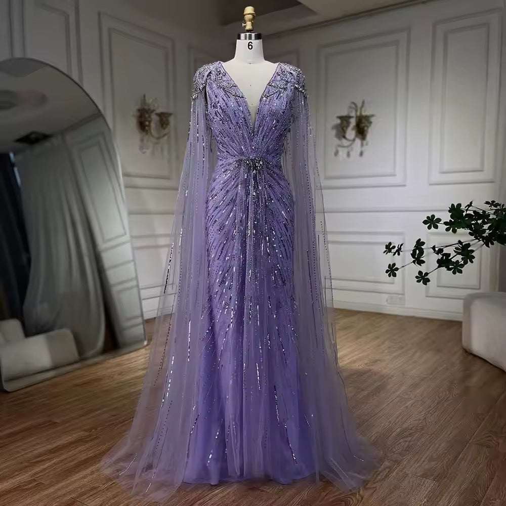 Elegant Fitted Gown with Beaded Details and Dramatic Cape