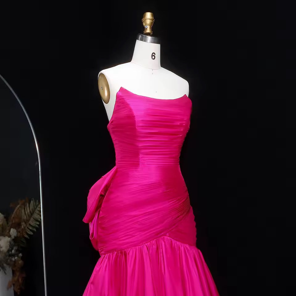 Shiny mermaid dress with elegant pleated details and bold back bow