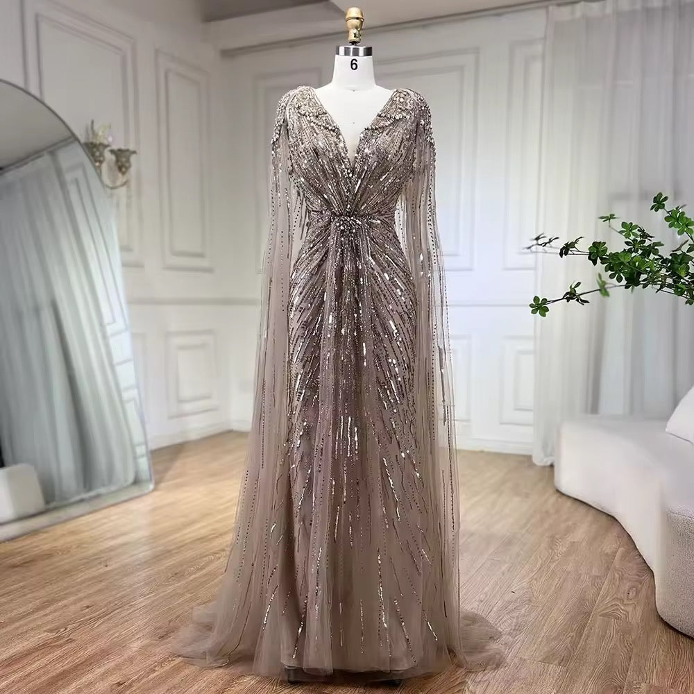 Elegant Fitted Gown with Beaded Details and Dramatic Cape