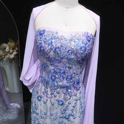 Whispering Bloom Embroidered Gown with Draped Cape and 3D Blue Florals