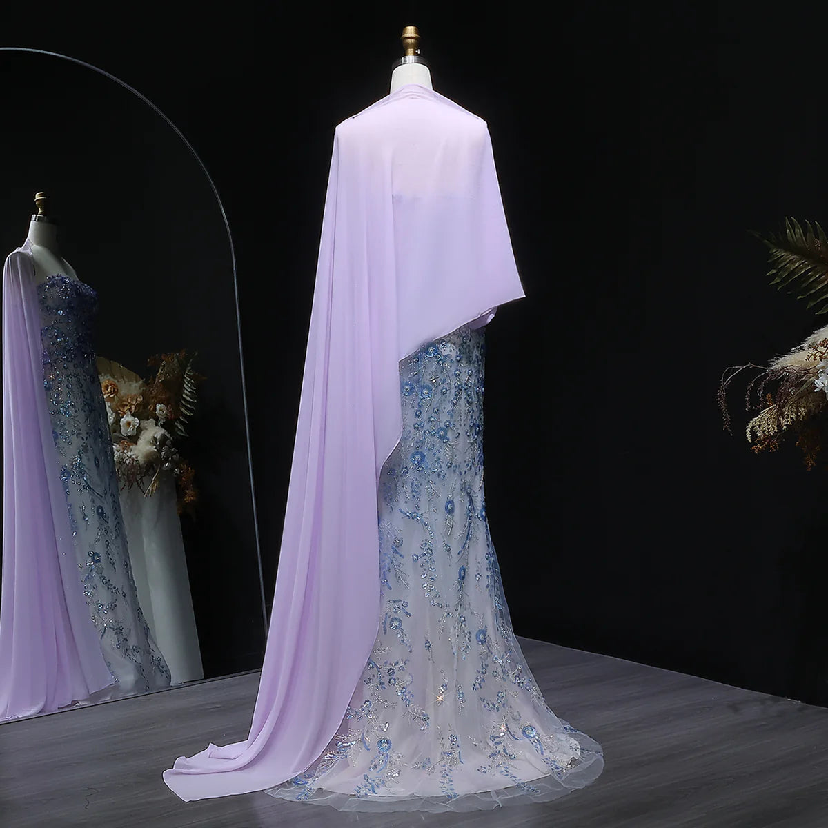 Whispering Bloom Embroidered Gown with Draped Cape and 3D Blue Florals