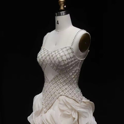 Elegant Off-White Crystal Bodice Gown with Voluminous Tulle Waves