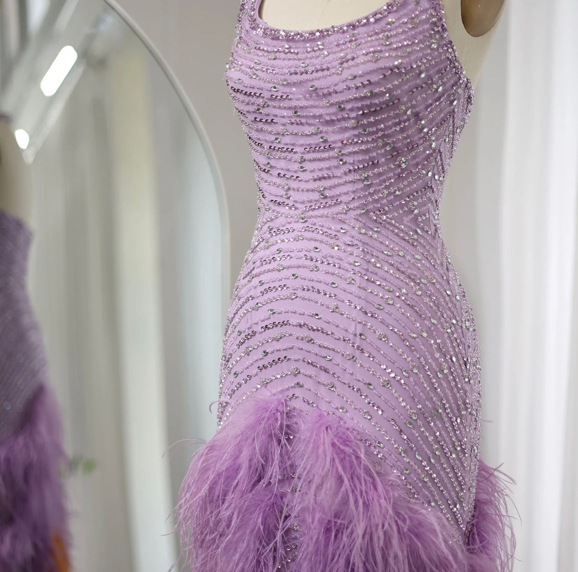 Purple dress with feathers and beads