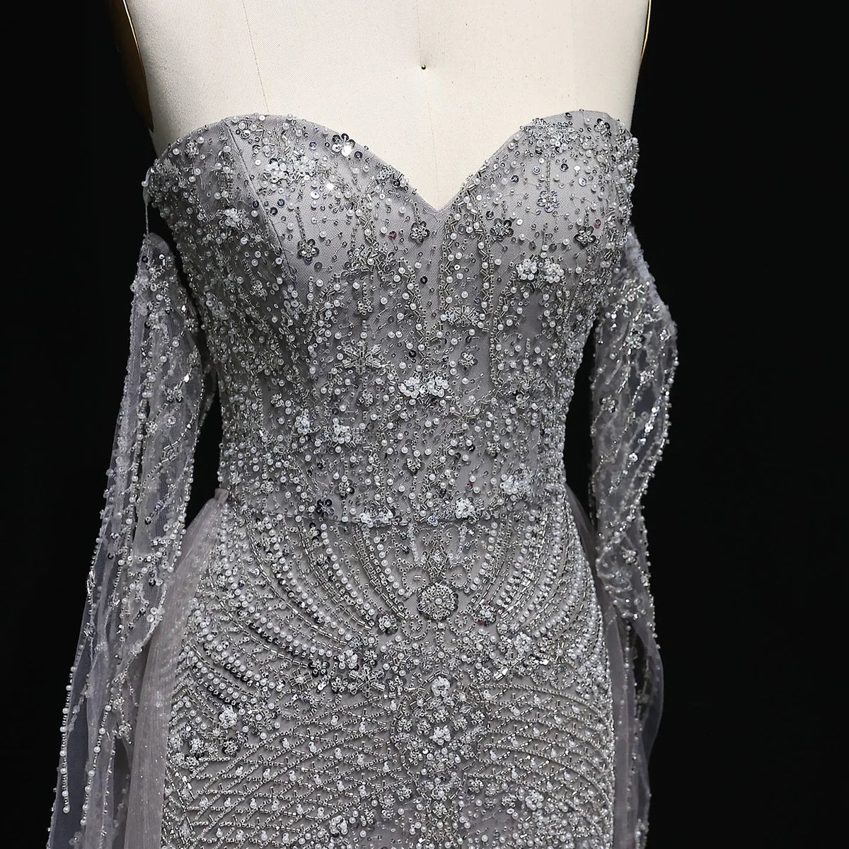 “Silver Cascade” Beaded Gown with Draped Crystal Sleeves and Matching Overlay