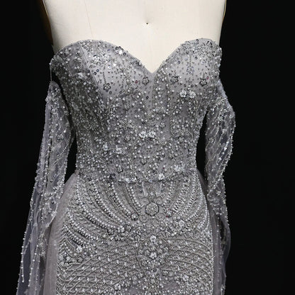 “Silver Cascade” Beaded Gown with Draped Crystal Sleeves and Matching Overlay