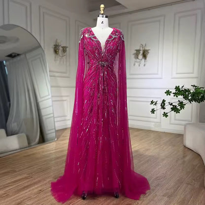 Elegant Fitted Gown with Beaded Details and Dramatic Cape