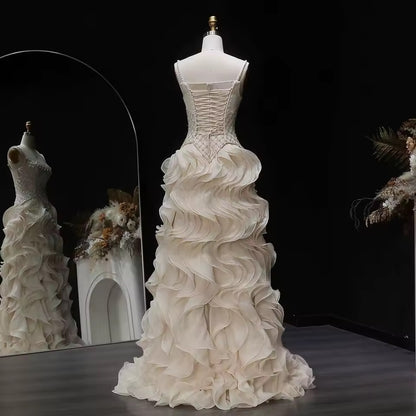 Elegant Off-White Crystal Bodice Gown with Voluminous Tulle Waves