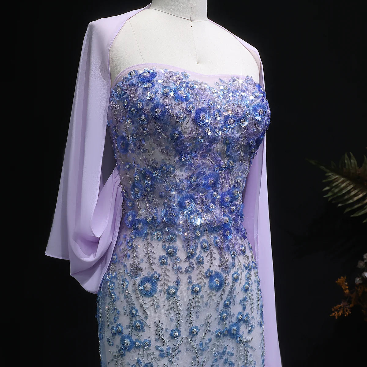 Whispering Bloom Embroidered Gown with Draped Cape and 3D Blue Florals