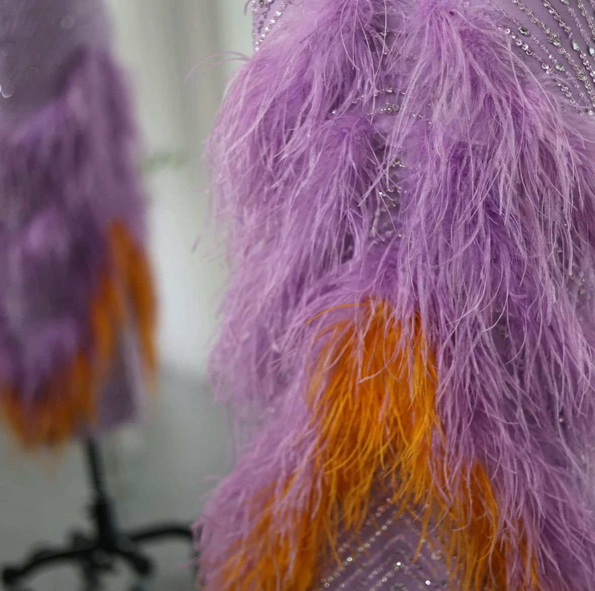 Purple dress with feathers and beads