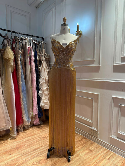 Glamorous Gold Strapless Gown with Shell-Inspired Crystals and Radiant Tassel Skirt