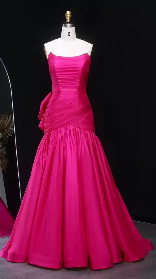 Shiny mermaid dress with elegant pleated details and bold back bow