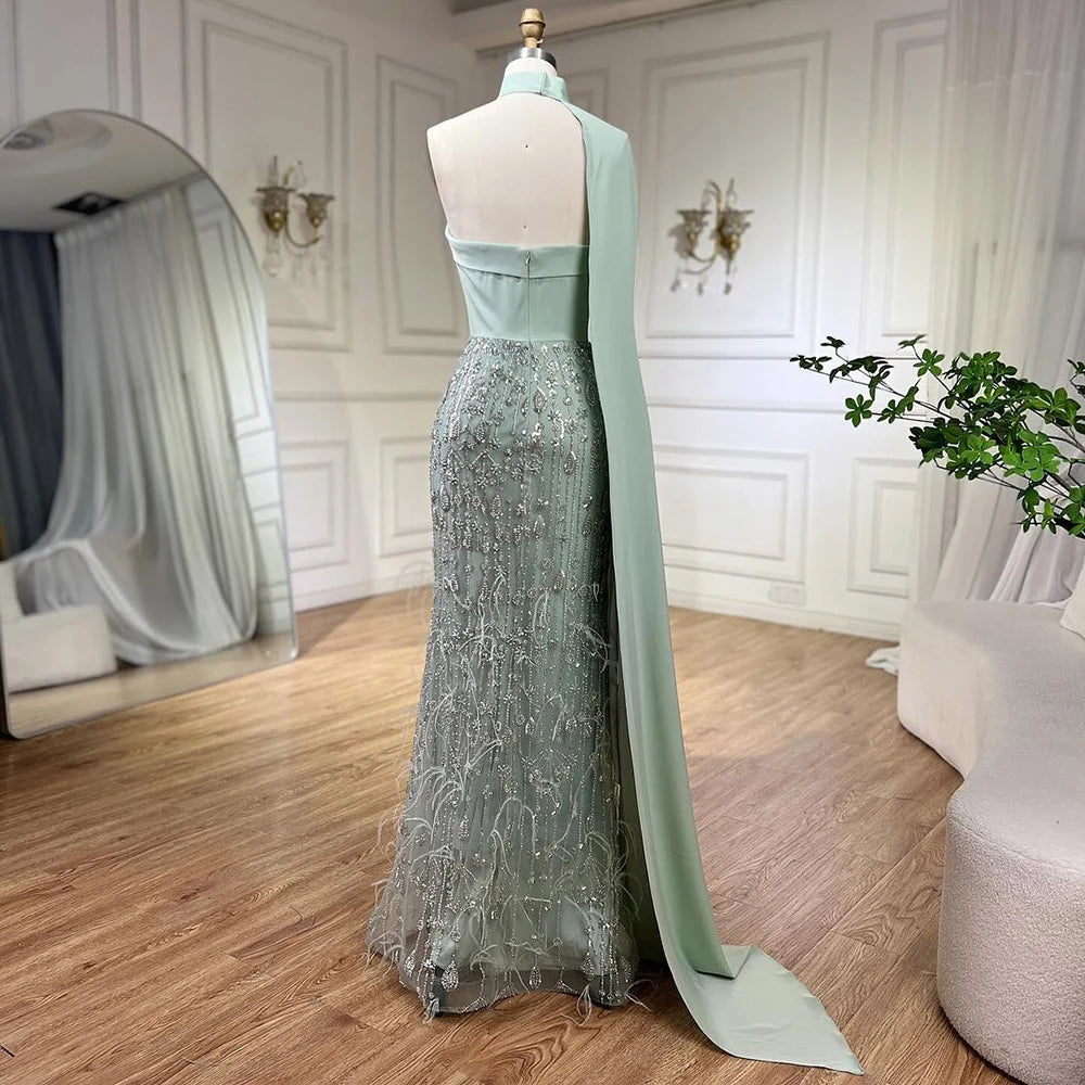 Sage Green dress decorated with feathers