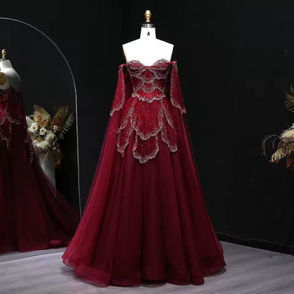 ‏Luxury Sage Green Off-Shoulder Evening Gown with Cape Sleeves
