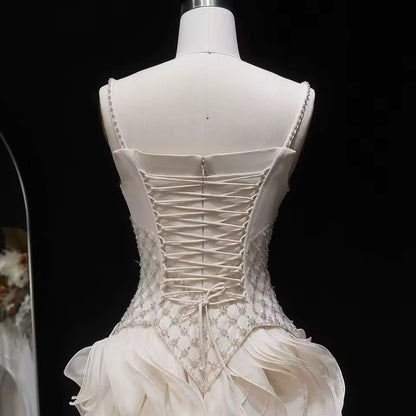 Elegant Off-White Crystal Bodice Gown with Voluminous Tulle Waves