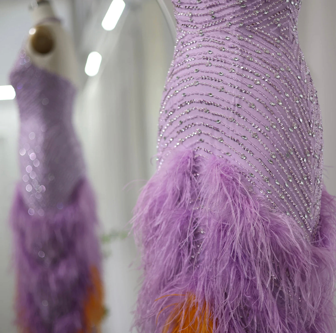 Purple dress with feathers and beads