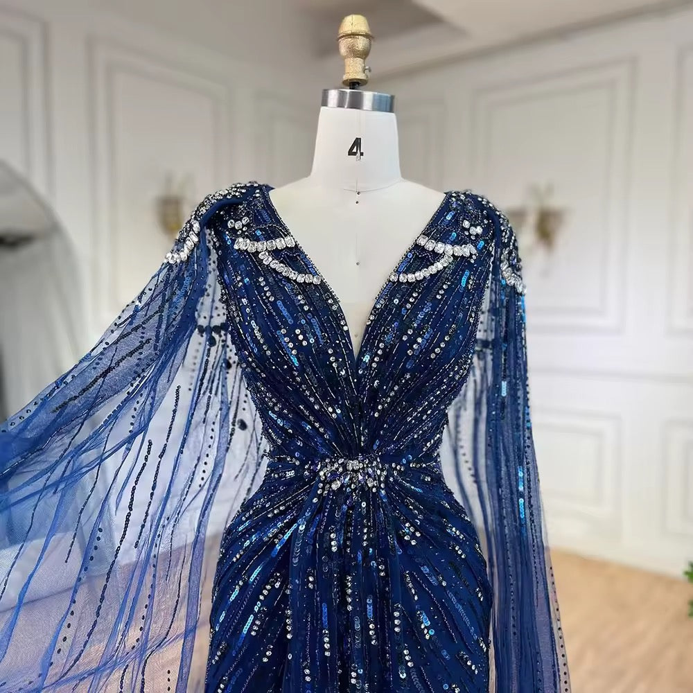Elegant Fitted Gown with Beaded Details and Dramatic Cape