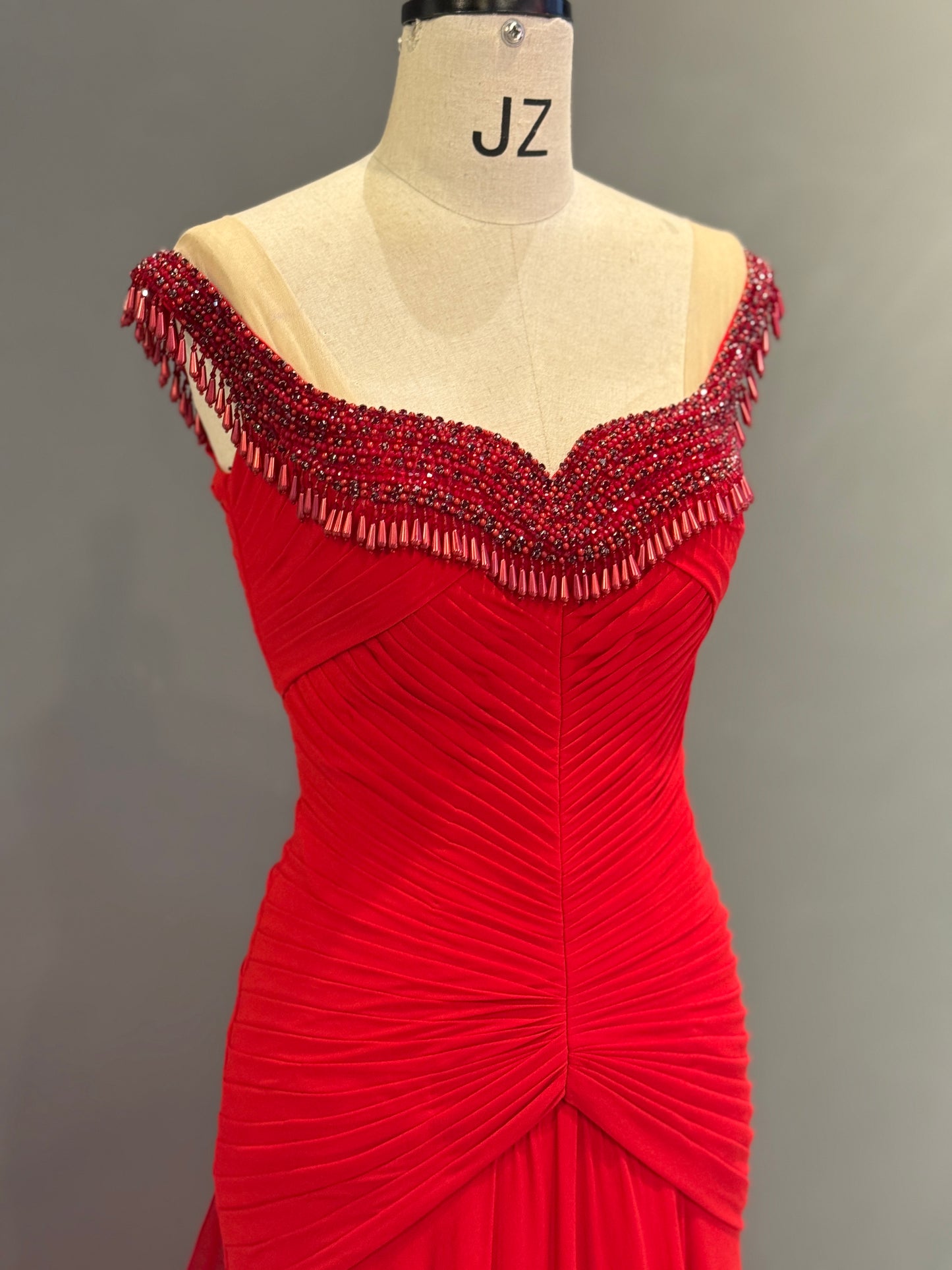 Luxury Vibrant Red Gown with Ruched Bodice and Beaded Neckline Fringe