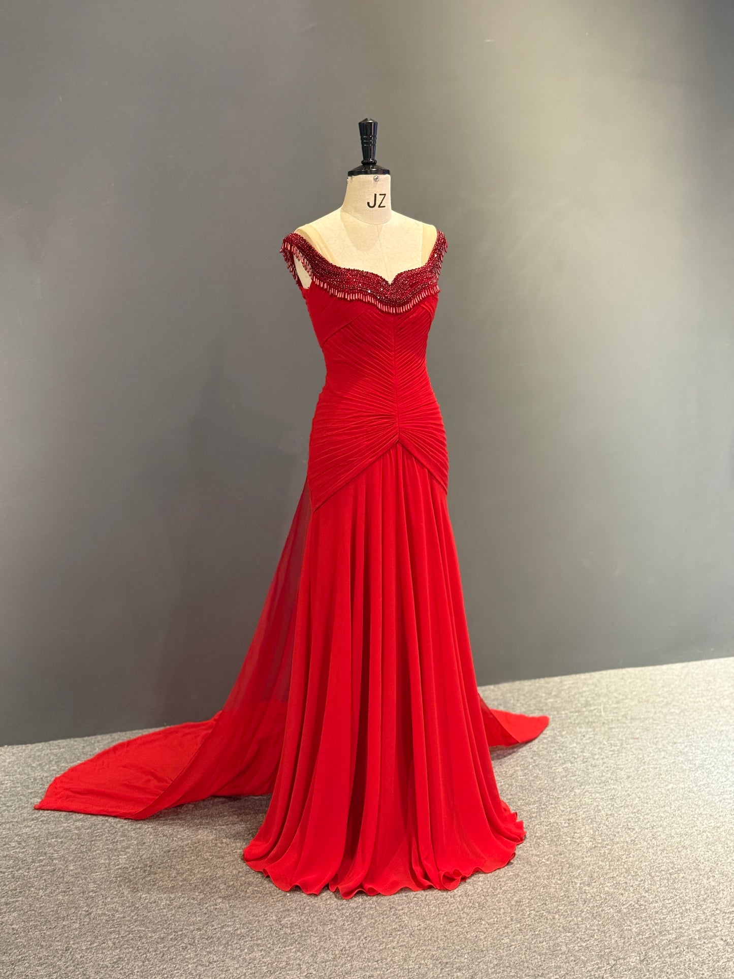 Luxury Vibrant Red Gown with Ruched Bodice and Beaded Neckline Fringe
