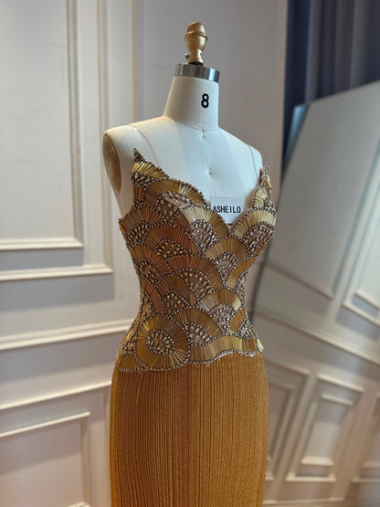Glamorous Gold Strapless Gown with Shell-Inspired Crystals and Radiant Tassel Skirt
