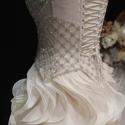 Elegant Off-White Crystal Bodice Gown with Voluminous Tulle Waves