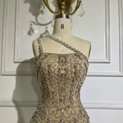“Crystal Symphony” Gown Nude crystal-embellished evening dress with asymmetric strap