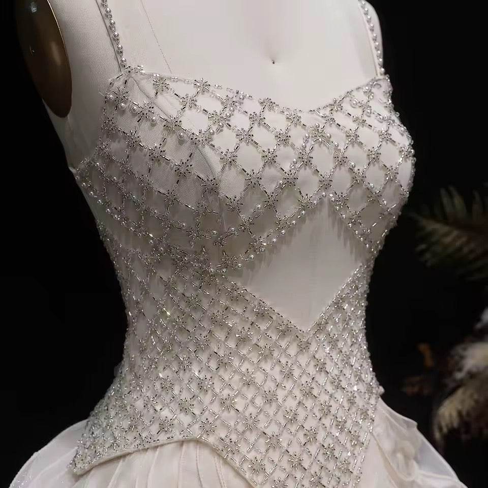Elegant Off-White Crystal Bodice Gown with Voluminous Tulle Waves