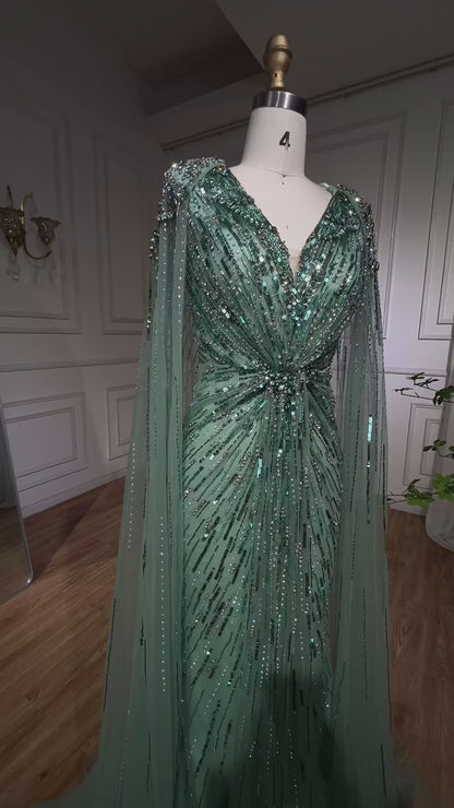 Elegant Fitted Gown with Beaded Details and Dramatic Cape